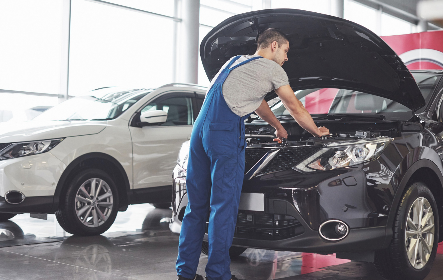 car-service-worker-repairing-vehicle Auto Mechanic Kingston